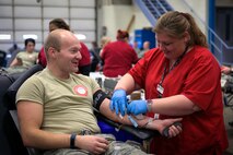 U.S. Air Force Staff Sgt. Ryan Porter, a fuels specialist with the 182nd Logistics Readiness Squadron, Illinois Air National Guard, donates blood in Peoria, Ill., Feb. 5, 2017. Porter and other Airmen helped exceed the installation’s goal by 14%, which provided 57 pints of blood during a national emergency need appeal by the American Red Cross. (U.S. Air National Guard photo by Tech. Sgt. Lealan Buehrer)