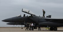 Capt. Michael Broyles, 335th Fighter Squadron weapons system officer walks across the wings of an F-15E Strike Eagle on Laughlin Air Force Base, Texas, Feb. 3, 2017. Broyles was able to visit Laughlin, his childhood home, during a cross-country trip in his aircraft. (U.S. Air Force photo/Airman 1st Class Benjamin N. Valmoja)
