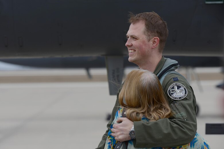 Capt. Michael Broyles, 335th Fighter Squadron weapons system officer (right), hugs his mother, Jill Broyles, on Laughlin Air Force Base, Texas, Feb. 3, 2017. Broyles visited his parents, who also served previously on Laughlin, during his stay while on a cross country trip in his aircraft. (U.S. Air Force photo/Airman 1st Class Benjamin N. Valmoja)