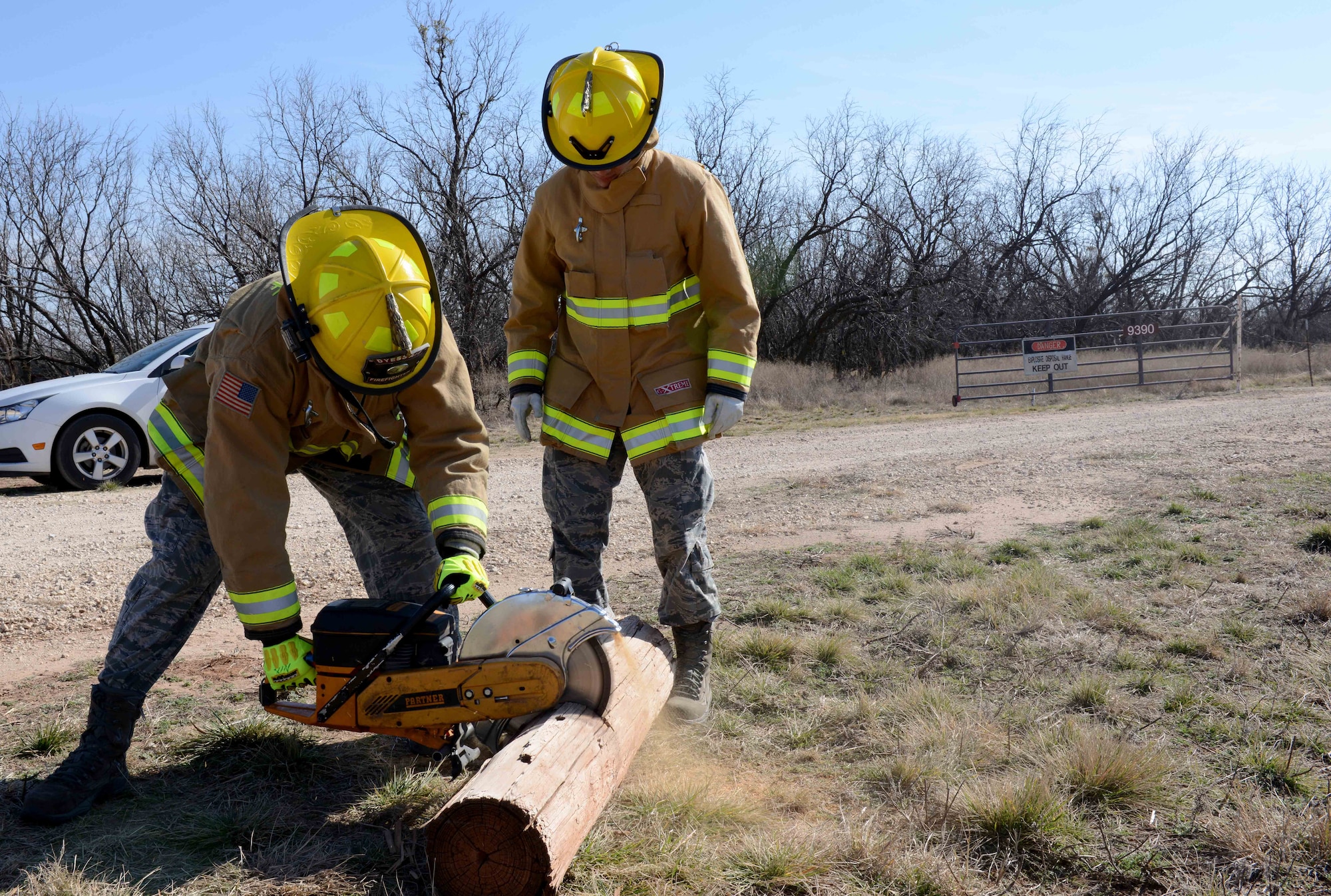 U.S. Air Force Airman 1st Class Colt Nix, 7th Civil Engineer Squadron firefighter, gets training on how to cut with a K-12 saw at Dyess Air Force Base, Texas, Feb. 2, 2017. The Dyess fire department use logs to train new Airmen on how to properly use the rescue saw. This tool is used for rooftop ventilation, a process in which a hole is cut into the roof of a burning building which allows smoke to escape. (U.S. Air Force photo by Airman 1st Class Austin Mayfield)