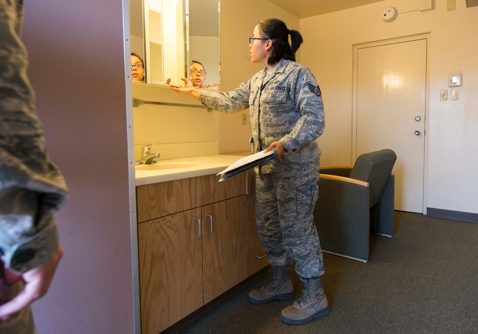 U.S. Air Force Staff Sgt. Marcela Serrano, 7th Civil Engineer Squadron airman dormitory leader, conducts a dorm inspection at Dyess Air Force Base, Texas, Feb. 7, 2017. Dorm management helps 30-40 Airmen daily process in and out of the dorms, coordinate maintenance work orders and answer questions about dorm life. They facilitate approximately 1,600 work orders a year, which can include anything from fixing an air conditioning unit to repairing an inoperable I.D. card reader. (U.S. Air Force photo by Airman 1st Class Austin Mayfield)