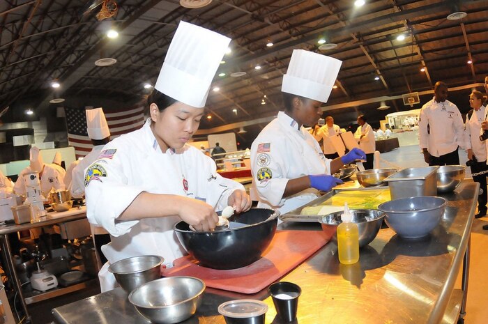 Contestants compete in a past Military Culinary Arts Competitive Training event at Fort Lee, Va., Feb. 9, 2017. In its 42nd year, the competition endeavors to improve the skills of military food service personnel, thereby enhancing force readiness. Photo by Terrance Bell