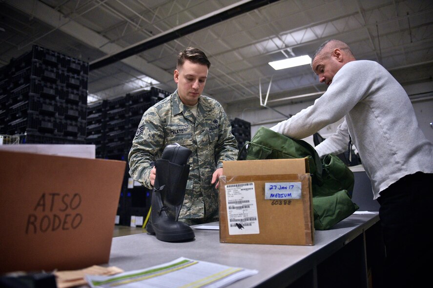 Staff Sgt. Antonio Pelayo checks his chemical warfare ensemble boot out for a two day practice with the 932nd Airlift Wing February 4, 2017, Scott Air Force Base, Ill.  The session was designed to test the unit's ability to survive and operate.  (U.S. Air Force photo by Tech. Sgt. Christopher Parr)