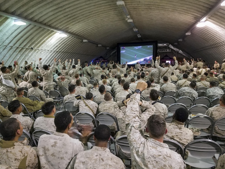 Marines and sailors cheer in response to a big play during the Palm Springs Bob Hope USO hosted showing of Super Bowl LI at the dining facility at Camp Wilson aboard Marine Corps Air Ground Combat Center, Twentynine Palms, Calif., Feb. 5, 2017. (U.S. Marine Corps photo by Cpl. Levi Schultz)