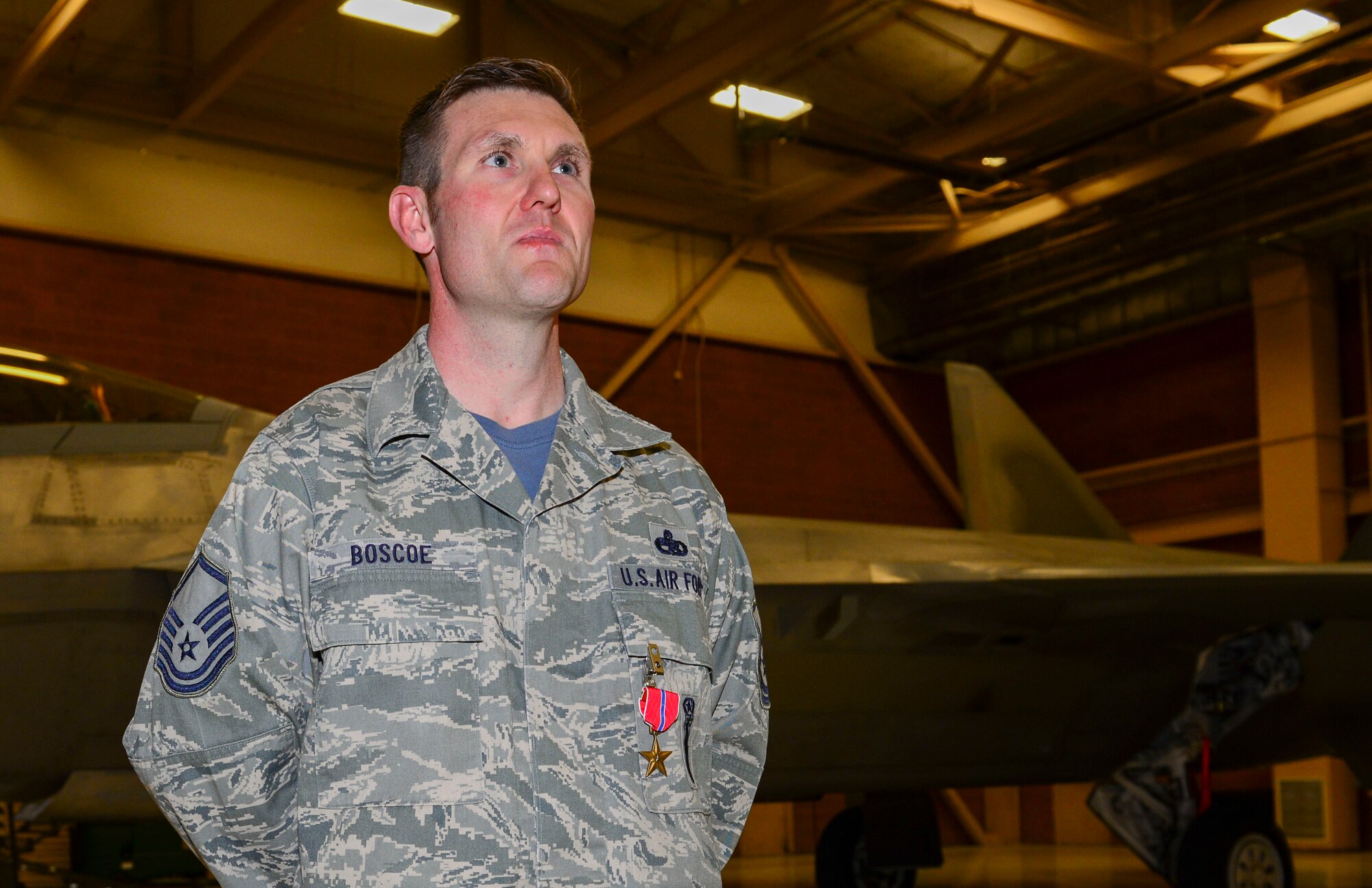 Master Sgt. Christopher Boscoe, 57th Aircraft Maintenance Squadron F-22 weapons section chief, poses for a photo after being awarded the Bronze Star Medal at Nellis Air Force Base, Nevada, Feb. 3, 2017. He was awarded the medal for his actions as a weapon system advisor in support of Operation Freedom Sentinel at Forward Operating Base Oqab, Kabul, Afghanistan from Oct. 4, 2015 to Sept. 28, 2016.