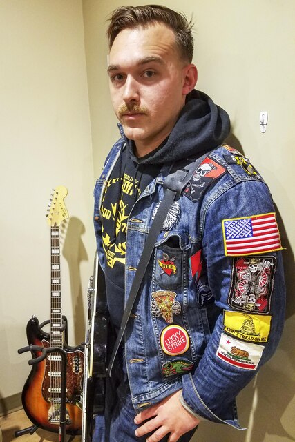 Sgt. Gene “Tripp” Ainsworth, platoon sergeant, Combat Camera, Headquarters Battalion, is working on publishing his second book. He spends much of his free time drawing, painting and playing his guitar. (U.S. Marine Corps photo by Cpl. Levi Schultz)