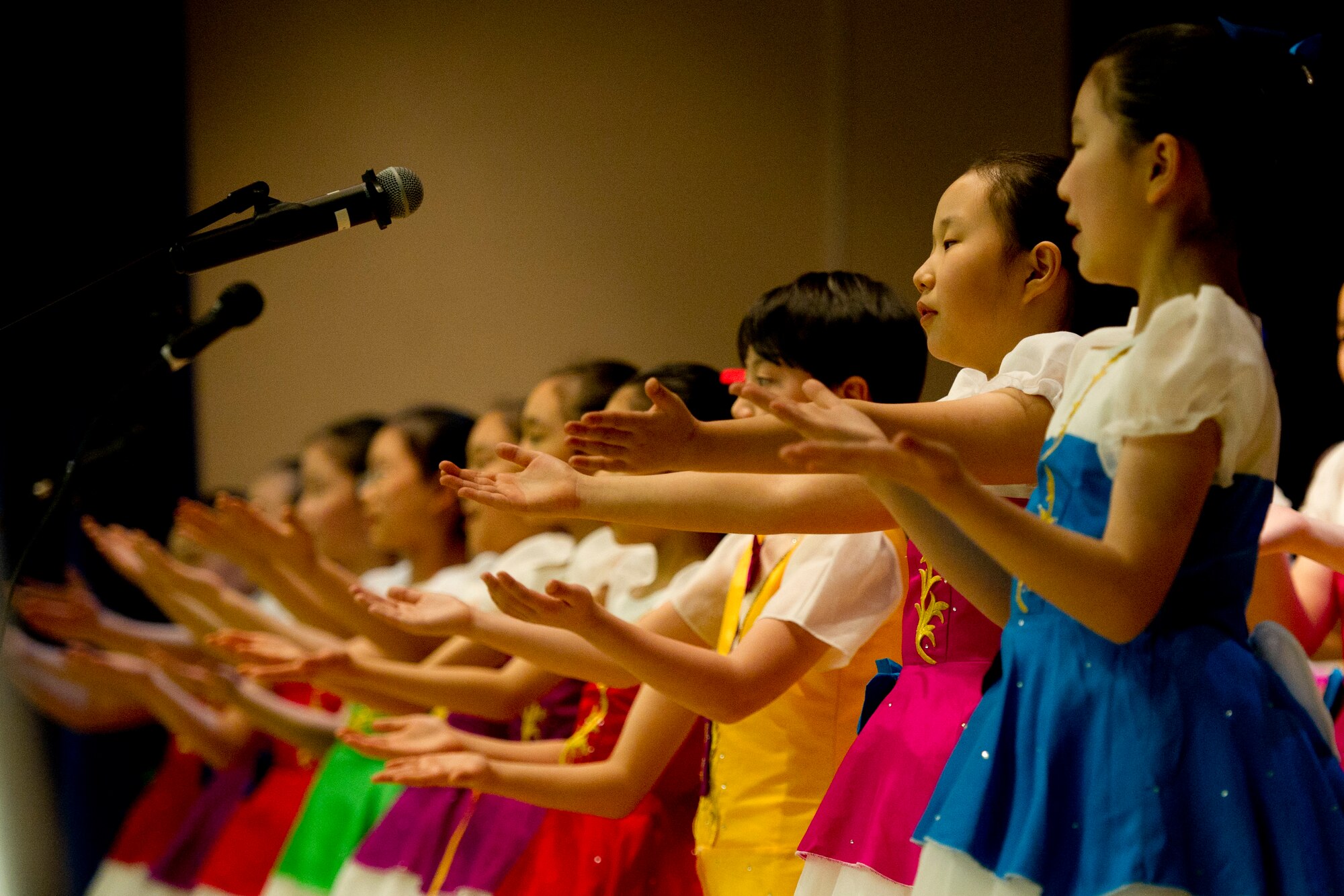 The Far East Broadcasting Company Children’s Choir sings to the audience at Osan’s National Prayer Breakfast 2017 at Osan Air Base, Republic of Korea, Feb. 8, 2017. The children’s choir, established in 1991, sang the U.S. and ROK national anthems along with a variety of other songs. (U.S. Air Force photo by Staff Sgt. Jonathan Steffen)