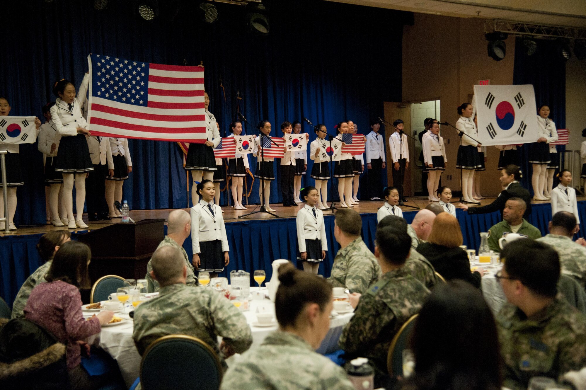 The Far East Broadcasting Company Children’s Choir performs at the Osan National Prayer Breakfast 2017 at Osan Air Base, Republic of Korea, Feb. 8, 2017. The National Prayer Breakfast was established in 1953 by President Dwight D. Eisenhower in effort to unite U.S. leadership. (U.S. Air Force photo by Staff Sgt. Jonathan Steffen)