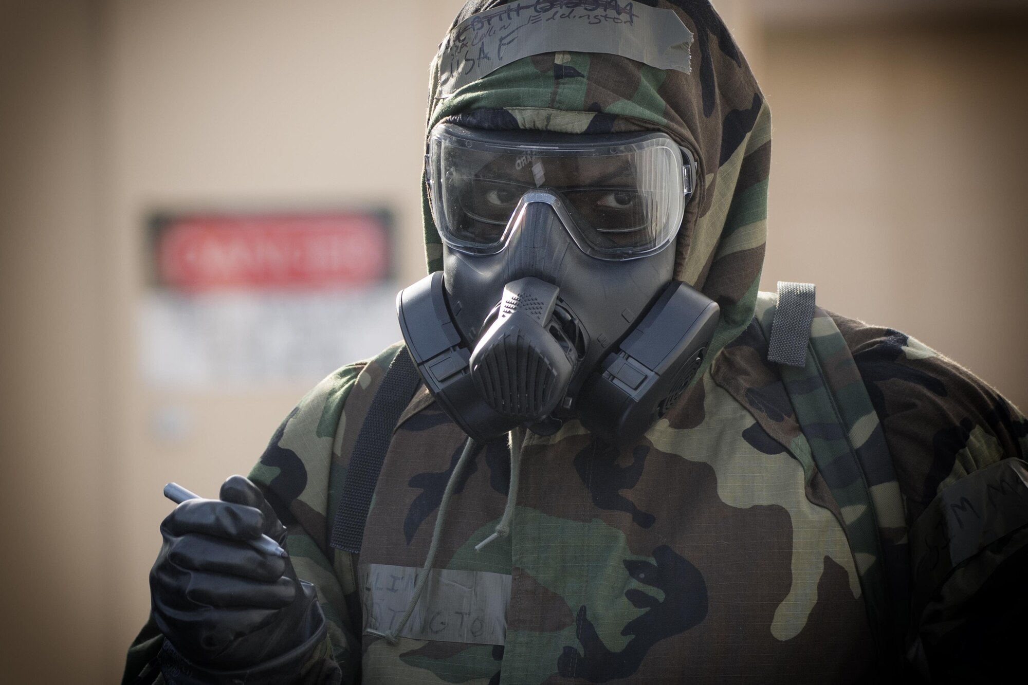 Senior Airman Collin Eddington, 374th Maintenance Squadron ISO aerospace maintenance apprentice, writes the date and time on a simulated M8 Chemical Agent Detection Paper during the Wartime Readiness Inspection at Yokota Air Base, Japan, Feb. 8, 2017. The inspection was designed to evaluate Yokota’s ability to provide airlift capabilities while responding to a variety of real-world scenarios. (U.S. Air Force photo by Yasuo Osakabe/Released)
