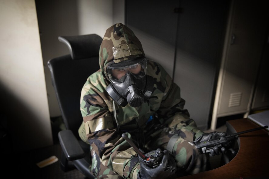 Tech. Sgt. Eric Peters, 374th Maintenance Squadron ISO aerospace maintenance NCO in charge, communicates with a Post Attack Reconnaissance team by a radio at Yokota Air Base, Japan, Feb. 8, 2018, during the Wartime Readiness Inspection. The inspection was designed to evaluate Yokota’s ability to provide airlift capabilities while responding to a variety of real-world scenarios. (U.S. Air Force photo by Yasuo Osakabe/Released)  