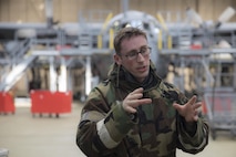 Senior Airman Britt Odom, 374th Maintenance Squadron ISO aerospace maintenance apprentice, talks to Wing Inspecting Team after a Post Attack Reconnaissance sweep at Yokota Air Base, Japan, Feb. 8, 2017, during the Wartime Readiness Inspection. The inspection was designed to evaluate Yokota’s ability to provide airlift capabilities while responding to a variety of real-world scenarios. (U.S. Air Force photo by Yasuo Osakabe/Released)