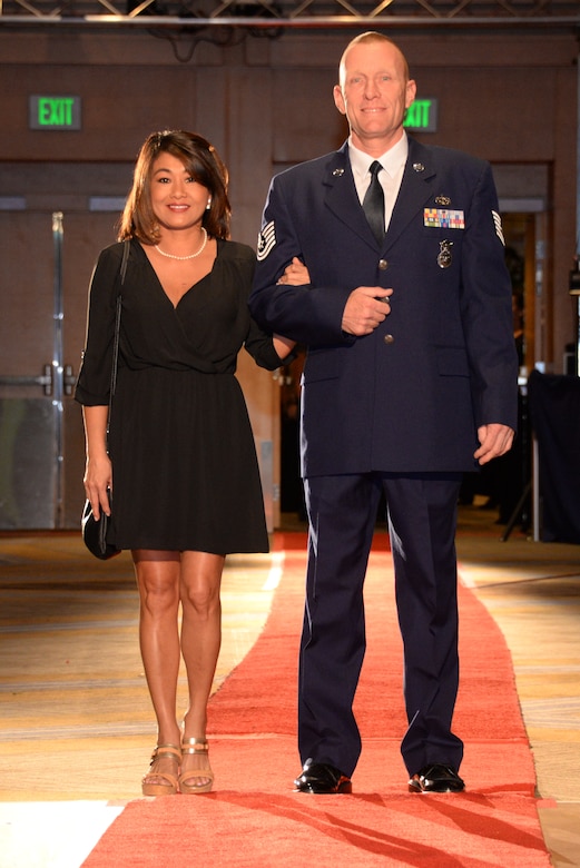 146th Airlift Wing's Tech. Sgt. Bryan Farmer and his fiancée Bay walk the red carpet at the 2017 Annual Outstanding Soldier/Airman of the Year Banquet. (U.S. ANG photo by: Staff Sgt. Kim Ramirez)