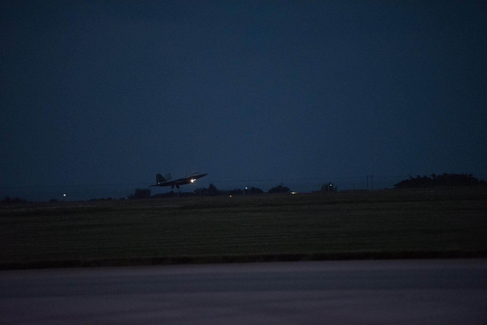 U.S. Air Force F-22 Raptors from the 90th Fighter Squadron arrive at Kadena Air Base, Japan, Feb. 7, 2017, before continuing on to Royal Australian Air Base, Tindal. Through bilateral collaboration and synergistic actions, the U.S. and Australia each develop operationally resilient capabilities by training together. (U.S. Air Force photo by Senior Airman Omari Bernard/Released)