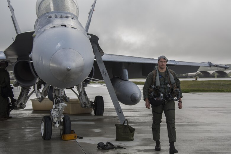 U.S. Marine Corps Capt. Bryan Boer, pilot and embarkation officer with VMFA (AW)-225, inspects an F/A-18D Hornet prior to his departure during exercise Cope North at Andersen Air Force Base, Guam, Feb. 9, 2017. The Marines loaded live air intercept missile – 120 advanced medium-range air-to-air missiles (AIM-120 AMRAAM) to F/A-18D Hornets to be fired at decoys down range. (U.S. Marine Corps photos by Cpl. Nathan Wicks)