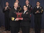 YOKOSUKA, Japan (February 10, 2017) Vice Adm. Joseph Aucoin, Commander, U.S. 7th Fleet, awards the 7th Fleet FY-16 Shore Sailor of the Year to Electronics Technician 1st Class Desiree N. Gonzales from Commander, Task Force SEVEN TWO. The program was established in 1972 by Chief of Naval Operations Adm. Elmo Zumwalt and Master Chief Petty Officer of the Navy John Whittet to recognize an individual Sailor who best represented the ever-growing group of dedicated professional Sailors at each command and ultimately the Navy. ET1 Gonzales, of Albuquerque, N.M., represent 7th Fleet at the U.S. Pacific Fleet SOY competition. (U.S. Navy photo by Petty Officer 2nd Class Jason Kofonow/Released)