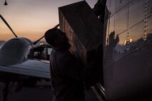 U.S. Air Force Staff Sgt. Mitchell Bloom, a 459th Airlift Squadron defensive carrier service technician from Yokota Air Base, Japan, loads a cargo box into a C-12 Huron at Misawa Air Base, Japan, Jan. 19, 2017. Whenever there are small equipment transports needed, the 730th Air Mobility Squadron works with qualified carriers to deliver goods between several bases. Depending on various factors, like windspeed, the C-12 can carry various weights and up to 10 passengers. (U.S. Air Force photo by Airman 1st Class Sadie Colbert)
