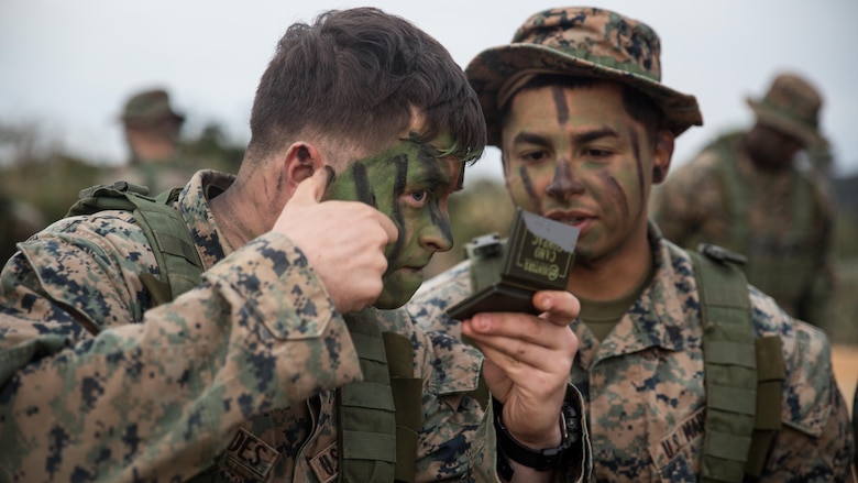 Lance Cpl. Lane Fernandes, left, and Cpl. Fransico Hernandez, infantrymen with Fox Company, Battalion Landing Team, 2nd Battalion, 5th Marines, 31st Marine Expeditionary Unit, apply camouflage face paint in preparation for a patrol exercise at the Jungle Warfare Training Center, Camp Gonsalves, Okinawa, Japan, Jan. 25, 2017. JWTC exposes Marines to training situations and environments unique to the Indo-Asia-Pacific region which sustain operational readiness and enhance forward deployed capabilities. As the Marine Corps’ only continuously forward deployed unit, the 31st Marine Expeditionary Unit’s air-ground-logistics team provides a flexible force, ready to perform a wide range of military operations, from limited combat to humanitarian assistance operations, throughout the Indo-Asia- Pacific region.