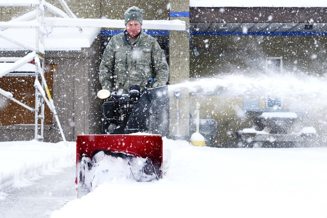 New York Air National Guard Master Sgt. James Babcock uses a snowblower to clear a path at Stewart Air National Guard Base, Newburgh, N.Y., Feb. 9, 2017. The northeast was hammered with a major snowstorm making travel treacherous. Babcock is assigned to the New York Air National Guard’s 105th Airlift Wing. Air National Guard photo by Staff Sgt. Julio A. Olivencia Jr.