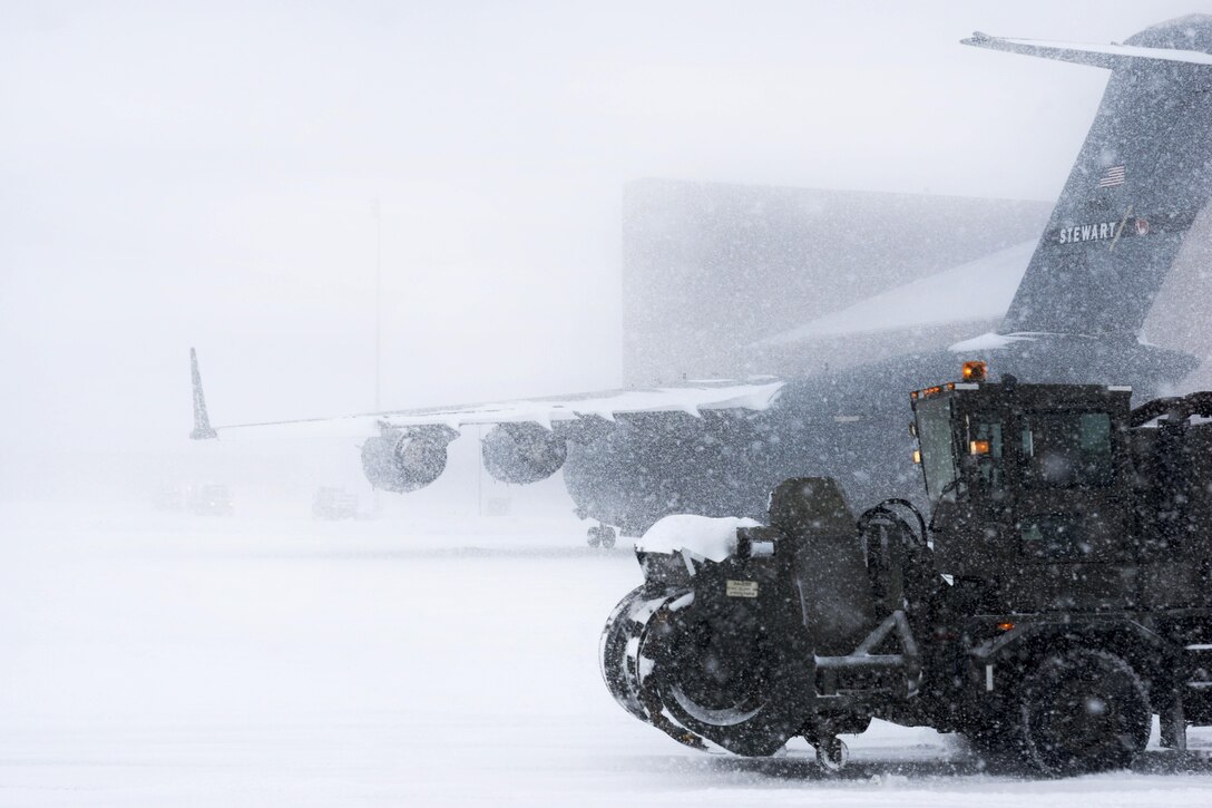 New York Air National Guardsmen operate a snowblower to remove snow from the flight line at Stewart Air National Guard Base, Newburgh, N.Y., Feb. 9, 2017. Air National Guard photo by Staff Sgt. Julio A. Olivencia Jr.