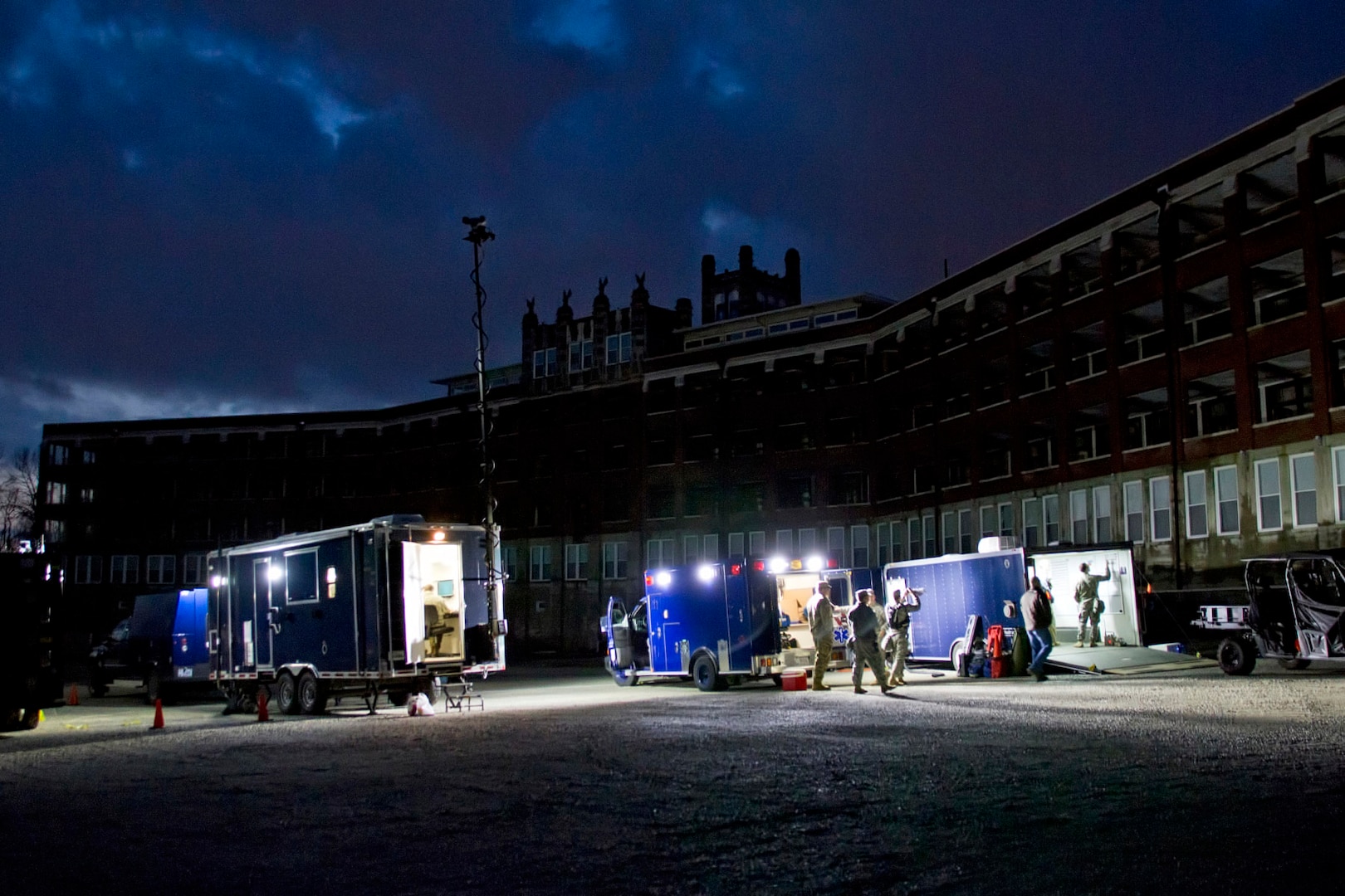 Soldiers of the 41st Civil Support Team stage vehicles during a hazardous materials exercise at the Waverly Hills Sanatorium in Louisville, Ky., Feb. 7, 2016. The team used the historic site as a suitable location for a mission with low visibility and limited communications in an unfamiliar environment. 