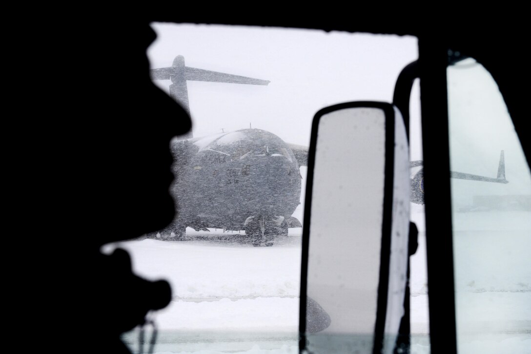 New York Air National Guard Senior Airman Ariel Paulino drives his dump truck across the flight line to have it filled with snow at Stewart Air National Guard Base, Newburgh, N.Y., Feb. 9, 2017. Paulino is assigned the New York Air National Guard’s 105th Civil Engineer Squadron, 105th Airlift Wing. Air National Guard photo by Staff Sgt. Julio A. Olivencia Jr.