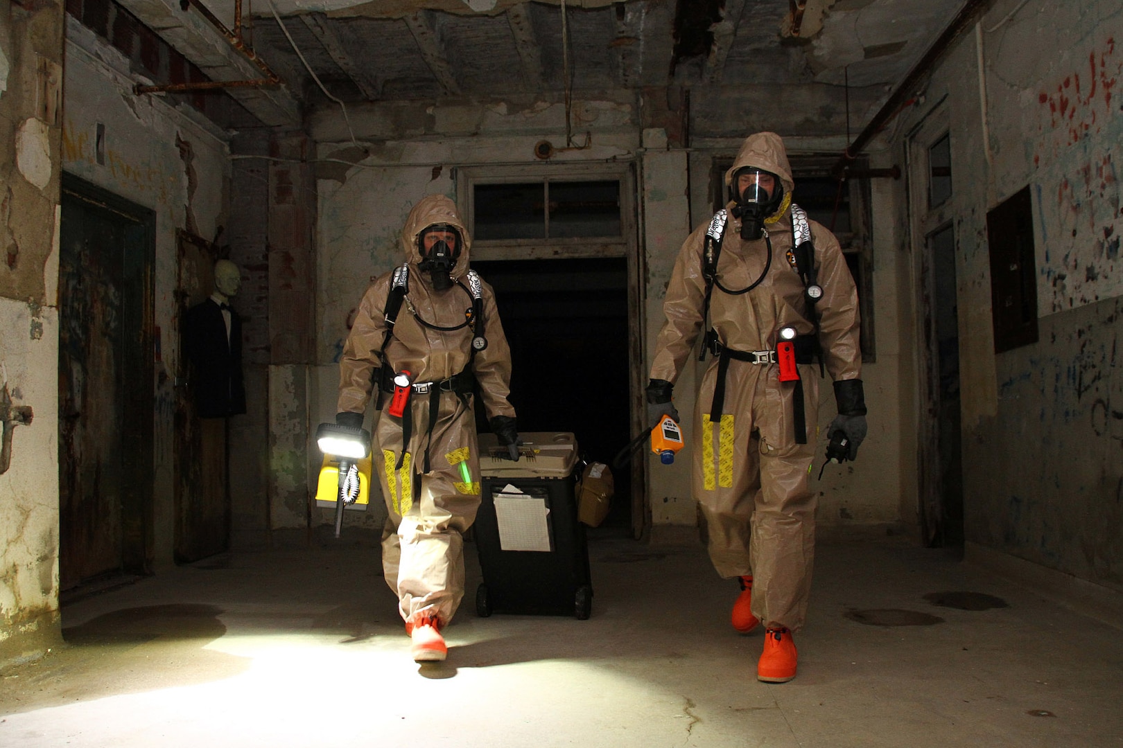 Staff Sgt. Patrick McCoy, left, and Sgt. Aaron Brady with the 41st Civil Support Team, search for a suspected biological threat during a hazardous materials exercise at the Waverly Hills Sanatorium in Louisville, Ky., Feb. 7, 2016. 
