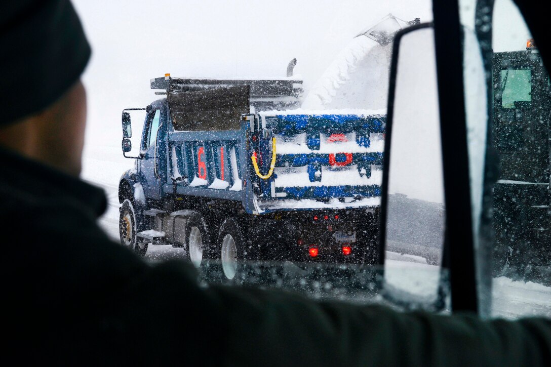 New York Air National Guard Senior Airman Ariel Paulino waits in line to have his dump truck filled with snow at Stewart Air National Guard Base, Newburgh, N.Y., Feb. 9, 2017. Paulino is assigned to the New York Air National Guard’s 105th Civil Engineer Squadron, 105th Airlift Wing. Air National Guard photo by Staff Sgt. Julio A. Olivencia Jr.
