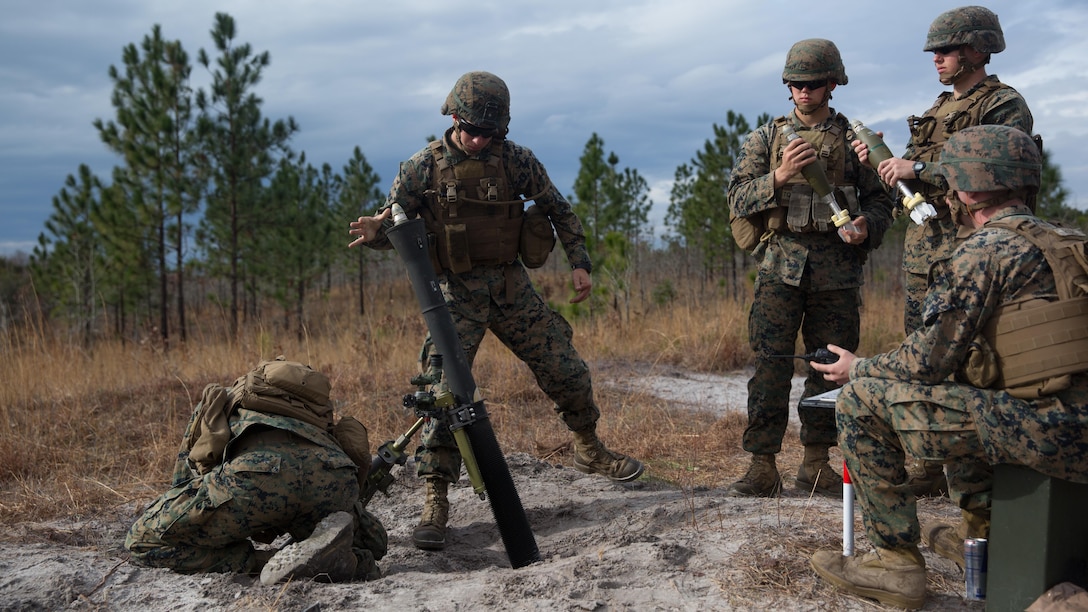 A Marine with Weapons Company, 2nd Battalion, 6th Marine Regiment drops an M821A2 High Explosive mortar round into an M252A2 81mm mortar system seconds before firing at Camp Lejeune, N.C., Feb. 8, 2017. The Marines fired off red phosphorous and high explosive rounds during a training exercise where they were able to coordinate with Expeditionary Warfare Training Group Atlantic during their qualification training for Joint Terminal Attack Controllers.