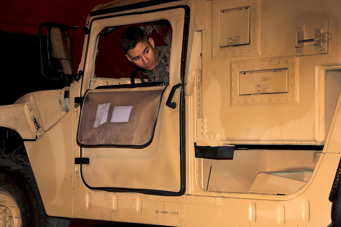 Sgt. Ryan Tugas backs up a Humvee during an inspection aboard Marine Corps Air Station Cherry Point, N.C., Jan. 31, 2017. Tugas attributes his time as a Boy Scout to his positive leadership skills he has utilized in the Marine Corps that has led him to be meritorious promoted through the noncommissioned officer ranks. Tugas is assigned to Marine Tactical Air Command Squadron 28, Marine Air Control Group 28, 2nd Marine Aircraft Wing. (U.S. Marine Corps photo by Cpl. Jason Jimenez/ Released)