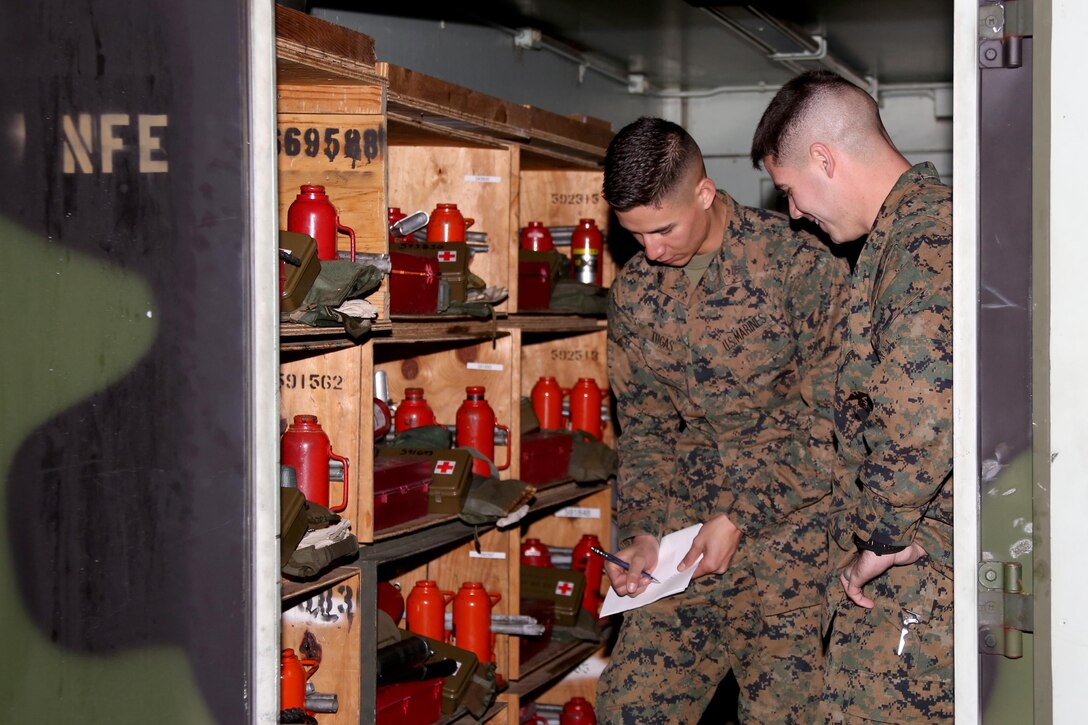Sgt. Ryan Tugas, left, and Sgt. Devon Bushey assess motor transport inventory for Marine Tactical Air Command Squadron 28 during an inspection aboard Marine Corps Air Station Cherry Point, N.C., Jan. 31, 2017. “I am a better Marine because I was a boy scout,” said Tugas, a motor transport operator assigned to MTACS-28, Marine Air Control Group 28, 2nd Marine Aircraft Wing. Tugas attributes leadership traits learned as a former Boy Scout to his success in the Marine Corps. Bushey is a motor transport operator with MTACS-28, Marine Air Control Group 28, 2nd Marine Aircraft Wing. (U.S. Marine Corps photo by Cpl. Jason Jimenez/ Released)