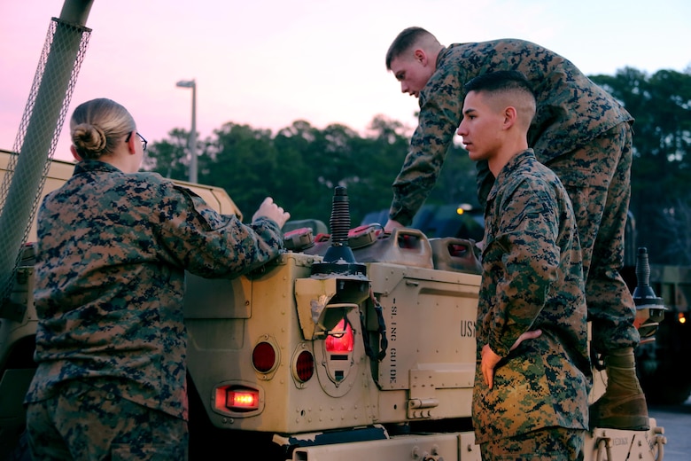 Sgt. Ryan Tugas, right, supervises Lance Cpl. Sarah Leazer, left, and Cpl. Taylor Bolduc while they participate in an inspection aboard Marine Corps Air Station Cherry Point, N.C., Jan. 31, 2017.  Leazer and Bolduc are Tugas’ Marines in the motor transport section of Marine Tactical Air Command Squadron 28. Tugas, Bolduc and Leazer are motor transport operators assigned to MTACS-28, Marine Air Control Group 28, 2nd Marine Aircraft Wing. (U.S. Marine Corps photo by Cpl. Jason Jimenez/ Released)