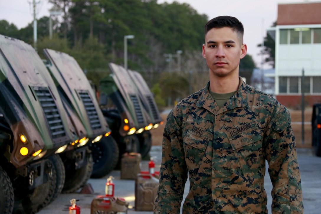 Days before being meritoriously promoted to the rank of sergeant, Cpl. Ryan Tugas stands among the Marine Tactical Air Command Squadron 28 vehicles he works with on a daily basis aboard Marine Corps Air Station Cherry Point, N.C., Jan. 31, 2017. Being a former Boy Scout, Tugas’ constant efforts to go above and beyond the call of duty to lead his Marines has catapulted him through the noncommissioned officer ranks. Tugas is a motor transport operator assigned toMTACS-28, Marine Air Control Group 28, 2nd Marine Aircraft Wing. (U.S. Marine Corps photo by Cpl. Jason Jimenez/ Released)