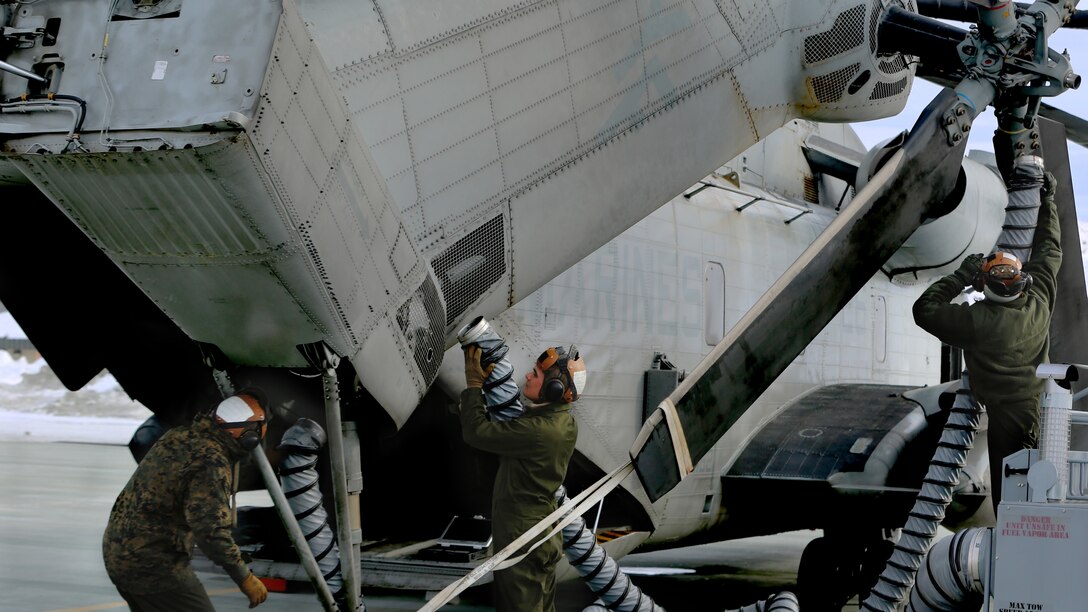 Marines with Marine Heavy Helicopter Squadron 462 “Heavy Haulers” prepare a CH-53E Super Stallion for flight at Marine Corps Mountain Warfare Training Center, Bridgeport, Calif., Feb. 1. Marines use a heater to warm the main systems on CH-53Es and ensure the aircraft is ready before starting the engines.