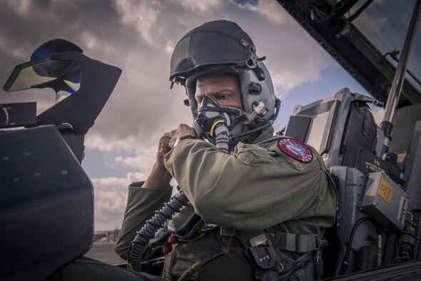An F-16 Fighting Falcon pilot, assigned to Detachment 1, 138th Fighter Wing, dons his helmet in preparation of a barnstorming performance for reporters, Feb. 1, 2017, in Houston. (U.S. Air National Guard photo/Tech. Sgt. Drew A. Egnoske)