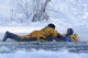 Airman 1st Class Joseph Humphrey (left), an Air Force fire protection specialist, and Airman 1st Class Tyler Parmelee conduct ice water rescue training at Joint Base Elmendorf-Richardson, Alaska, Feb. 4, 2017. The training taught the JB Elmendorf-Richardson firefighters self-rescue techniques, victim recovery and certified them as ice water rescue technicians. Humphrey and Parmelee, natives of Ridgecrest, Calif., and Ashburn, Va., are assigned to the 673rd Civil Engineer Squadron. (U.S. Air Force photo/Alejandro Pena)