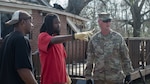 Soldiers of the 3656th Maintenance Co., 184th Sustainment Command, speak with home owner Jimmy Welch, whose house was damaged by a tornado that swept across southern Mississippi on Jan. 26, 2017.