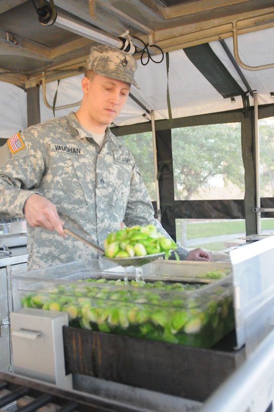 Army Reserve Staff Sgt. Jeffrey Vaughan, a Food Service NCO for the Military Intelligence Reserve Command, blanches brussels sprouts while preparing a meal out of a mobile kitchen trailer at the Orlando Armed Forces Reserve Center. Vaughan and the Army Reserve Culinary Arts Team were rehearsing for the upcoming 42nd Annual Military Culinary Arts Competition.