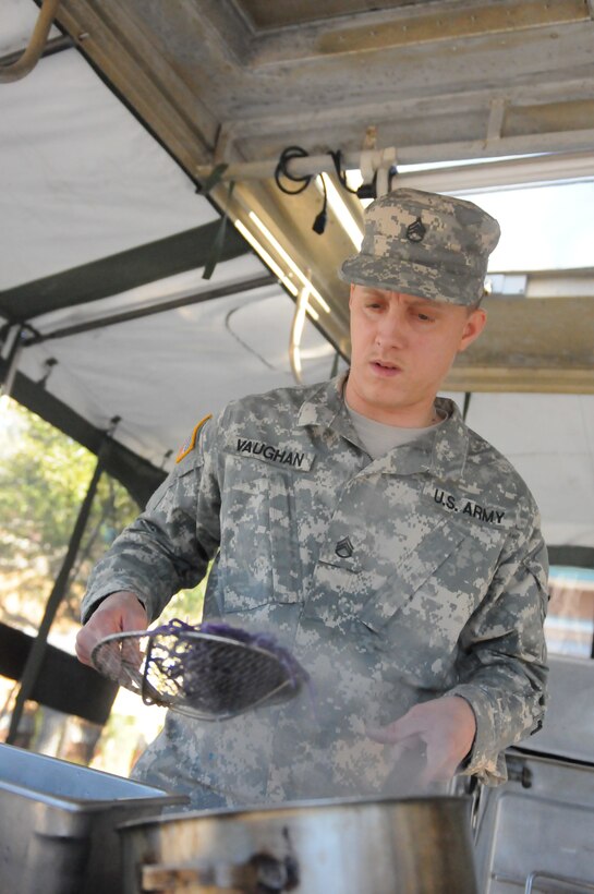 Army Reserve Staff Sgt. Jeffrey Vaughan, a Food Service NCO for the Military Intelligence Reserve Command, blanches cabbage while preparing a meal out of a mobile kitchen trailer at the Orlando Armed Forces Reserve Center. Vaughan and the Army Reserve Culinary Arts Team were rehearsing for the upcoming 42nd Annual Military Culinary Arts Competition.