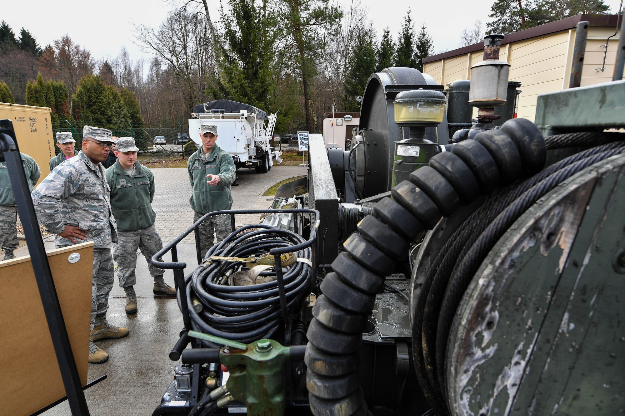 Lt. Gen. Richard M. Clark, 3rd Air Force commander, learns about equipment used by the 435th Construction and Training Squadron from Senior Airman Andrew Wiegand, 435 CTS aircraft arresting system maintenance technician, during an immersion tour of the 435th Air Ground Operations Wing at Ramstein Air Base, Germany, Feb. 3 2017. The tour featured displays from squadrons within the 4th Air Support Operations Group, 435th Air and Space Communications Group, and 435th Contingency Response Group. (U.S. Air Force photo by Senior Airman Tryphena Mayhugh) 