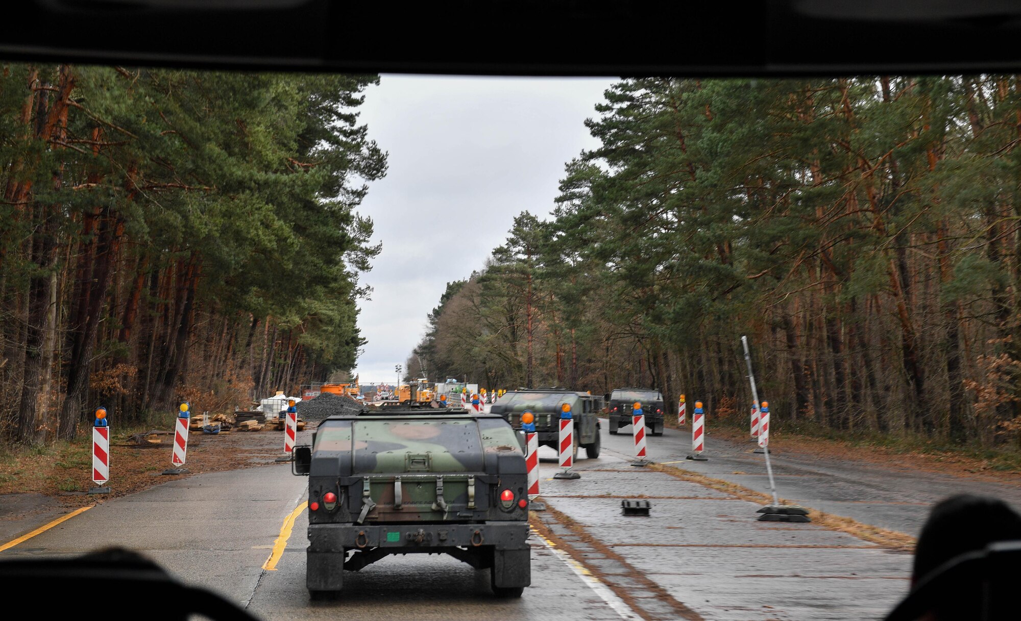 Leaders from the 3rd Air Force, U.S. Air Forces in Europe and Air Forces Africa, 435th Air Ground Operations Wing, and their spouses ride in Humvees during an immersion tour of the 435 AGOW at Ramstein Air Base, Germany, Feb. 3, 2017. Lt. Gen. Richard M. Clark, 3rd Air Force commander, participated in the tour to learn more about the wing’s mission, as he had recently assumed command in October 2016. (U.S. Air Force photo by Senior Airman Tryphena Mayhugh)