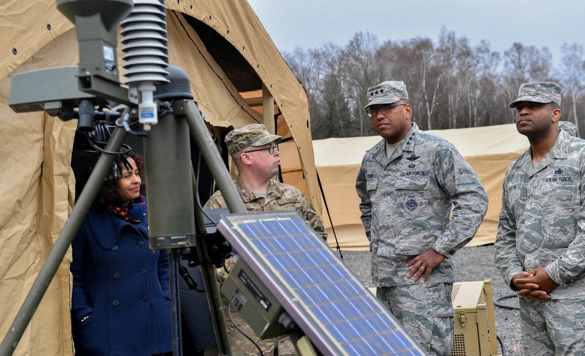 Master Sgt. Joshua Wisnewski, 7th Weather Squadron NCO in charge of training, briefs Lt. Gen. Richard M. Clark, 3rd Air Force commander, and Chief Master Sgt. Phillip Easton, U.S. Air Forces in Europe and Air Forces Africa command chief, about weather equipment during an immersion tour of the 435th Air Ground Operations Wing at Ramstein Air Base, Germany, Feb. 3, 2017. Clark, Easton, and their spouses toured squadrons within the 4th Air Support Operations Group, 435th Air and Space Communications Group, and 435th Contingency Response Group. (U.S. Air Force photo by Senior Airman Tryphena Mayhugh)