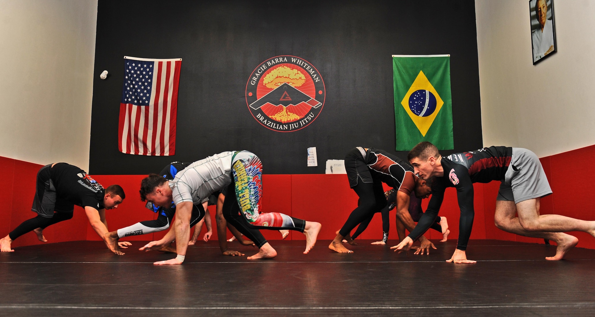 Students warm up during a Jiu Jitsu class by performing bear crawls at the fitness center on Whiteman Air Force Base, Mo., Feb. 3, 2017. Brazilian Jiu Jitsu, a ground based martial art, teaches practitioners to fight from their backs. Adult and youth classes are offered weekly at the Whiteman fitness center. (U.S. Air Force photo by Tech. Sgt. Miguel Lara)
