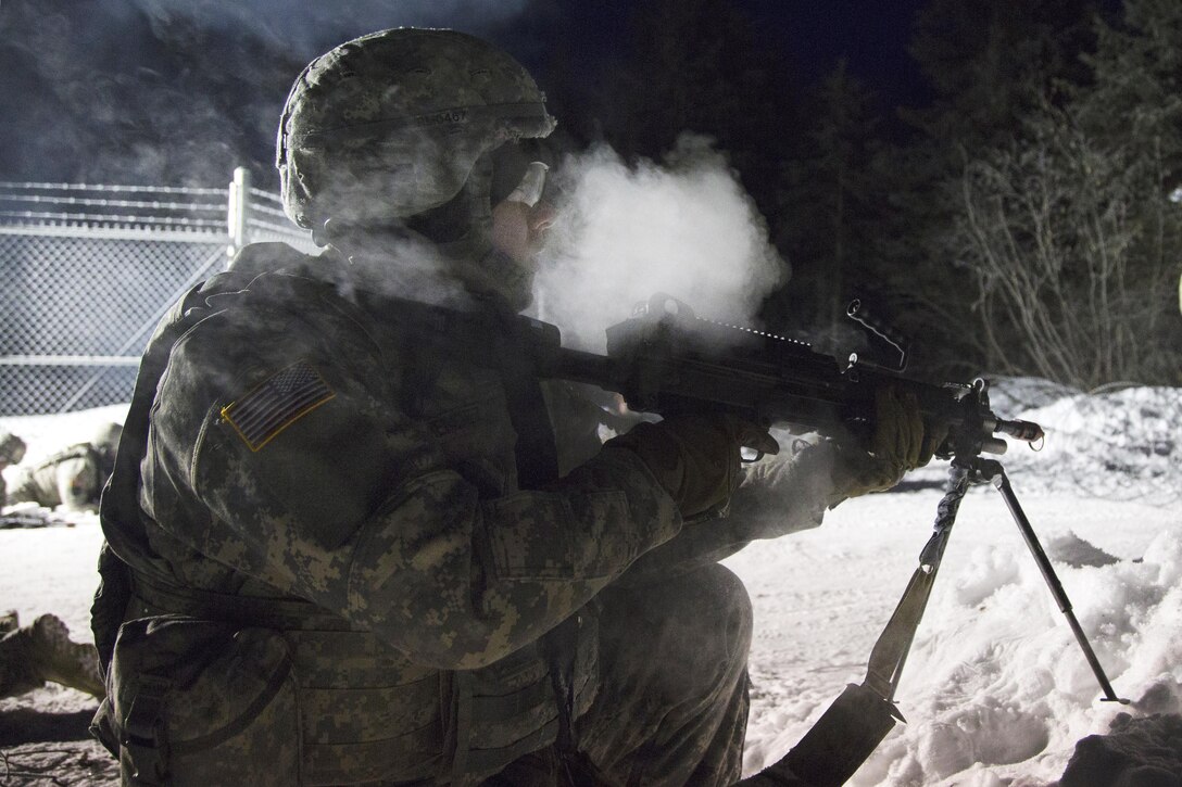 Army Pfc. Rolando Mendez scans his sector after taking fire from simulated opposing forces during force protection training at Joint Base Elmendorf-Richardson, Alaska, Feb. 2, 2017. Mendez is assigned to the 574th Composite Supply Company. Air Force photo by Alejandro Pena