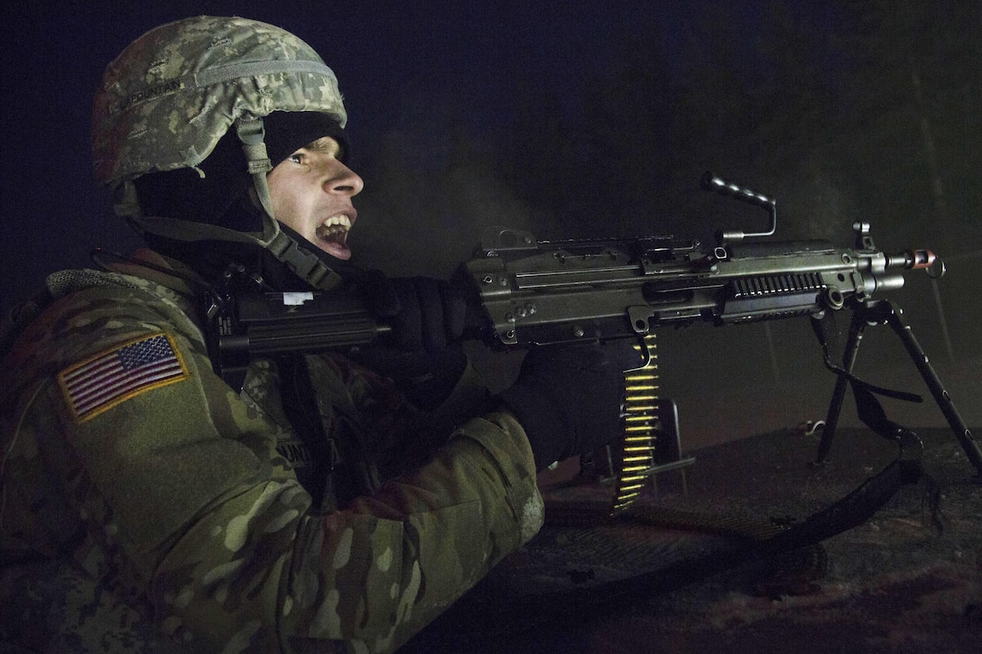 Army Spc. William Lafountain yells out directions to his team members during force protection training at Joint Base Elmendorf-Richardson, Alaska, Feb. 2, 2017. Lafountain is assigned to the 574th Composite Supply Company. Air Force photo by Alejandro Pena