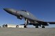 A B-1B Lancer of the 28th Bomb Squadron, 7th Operations Group, Dyess Air Force Base, Texas, sits near the historic hangar and Base Operations building while awaiting maintenance Jan. 27, 2017, at Tinker AFB, Oklahoma. 