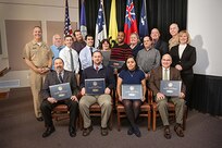 2016 Naval Sea Systems Command Warfare Center Awards were presented on Feb. 2 at NUWC Division Newport. Awards were presented by Rear Adm. Moises DelToro III (far left), commander, NUWC, Mary Wohlgemuth (far right), SES, technical director, NUWC Newport; and Capt. Geoffrey deBeauclair (back row, second from right), commanding officer, NUWC Newport.
