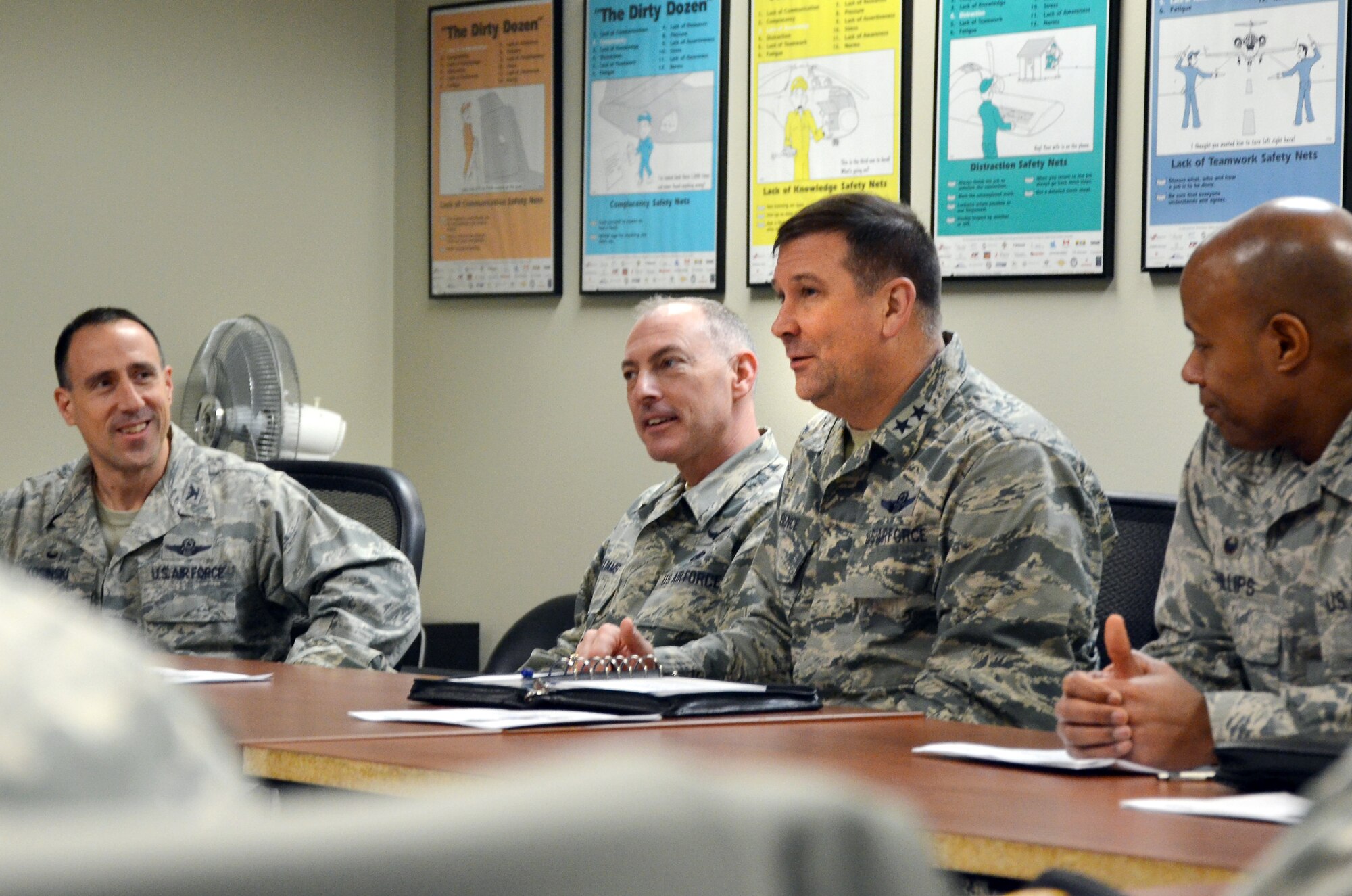 Maj. Gen. Christopher J. Bence, right, talks with other leaders during a Mobility Guardian briefing on McChord Field Wednesday. 
