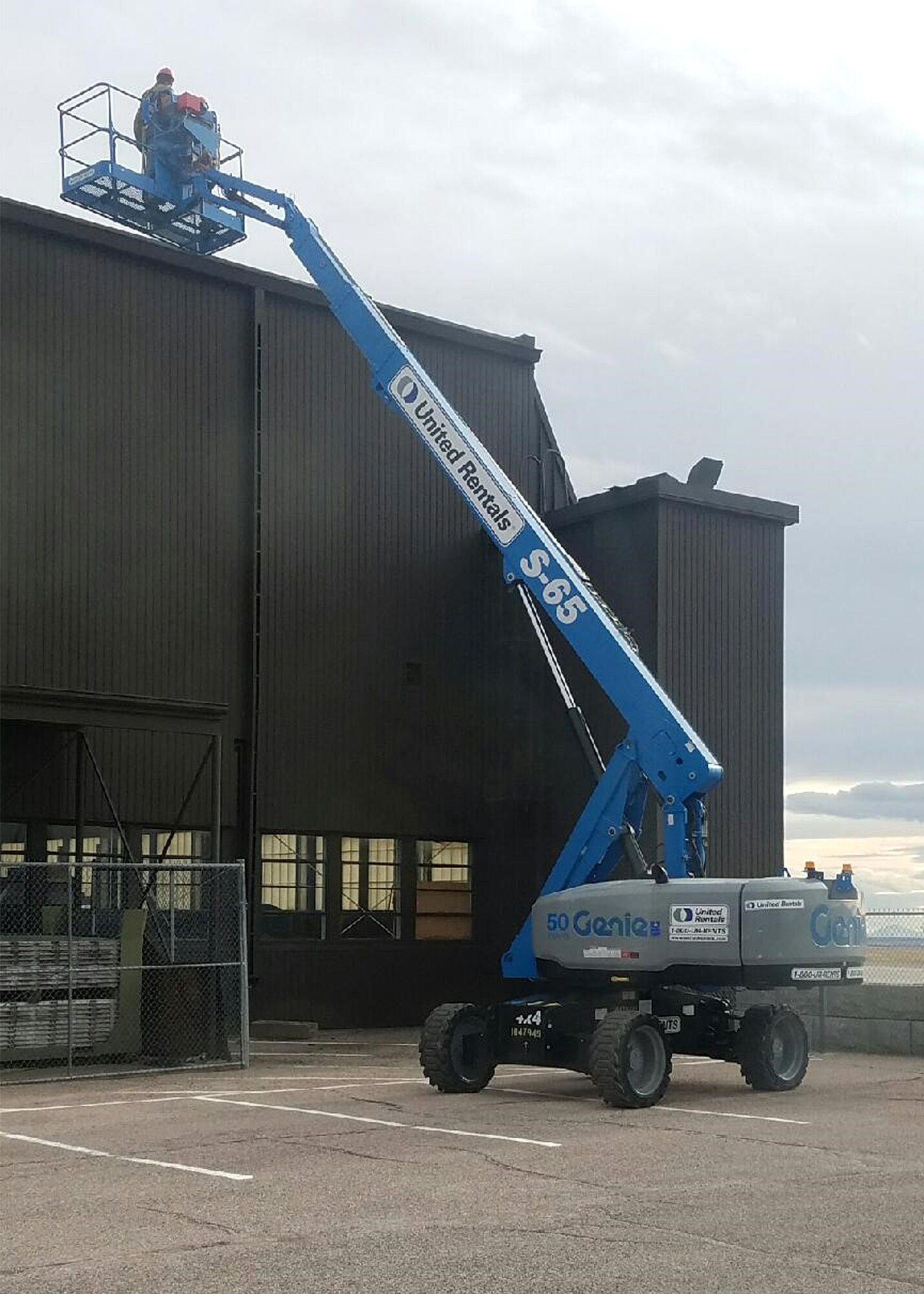 PETERSON AIR FORCE BASE, Colo. – The 21st Civil Engineer Squadron operations flight uses a sky lift to fix portions of a roof on a hangar along the flightline on Peterson Air Force Base, Colo., Jan. 12, 2017. The 21st CES Blackjack Engineers took a week in January to put extra effort toward tackling the backlog of corrective work orders. (Courtesy photo)