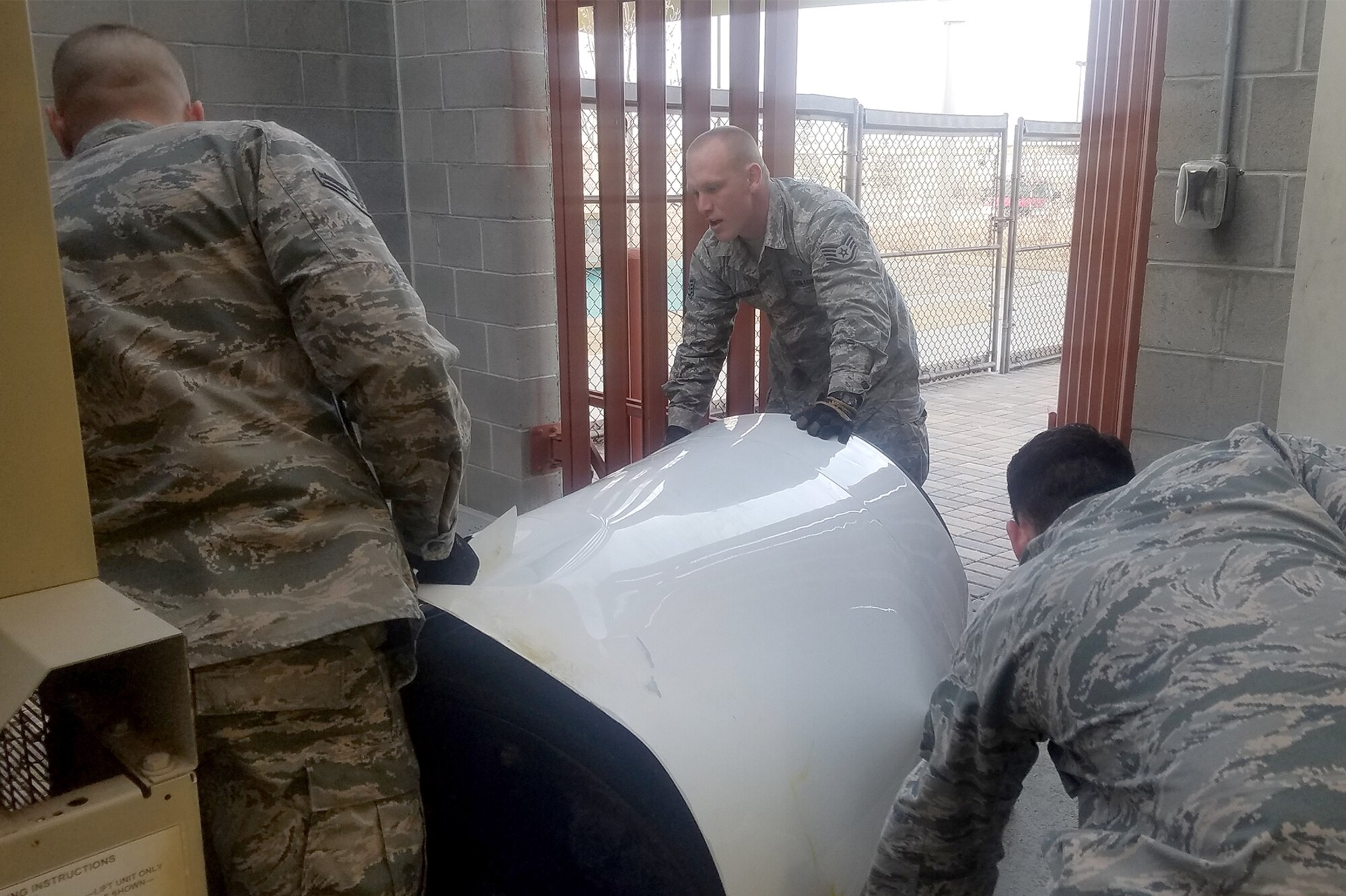 PETERSON AIR FORCE BASE, Colo. – Airmen from the 21st Civil Engineer Squadron water and fuels systems maintenance section remove an old hot water system in preparation for a new one at the Child Development Center on Peterson Air Force Base, Colo., Jan. 10, 2017. The new installed system will included an additional water heater and bypass line, making it possible to have a heater go down and still provide hot water to the building, thus eliminating a single point of failure. (Courtesy photo)