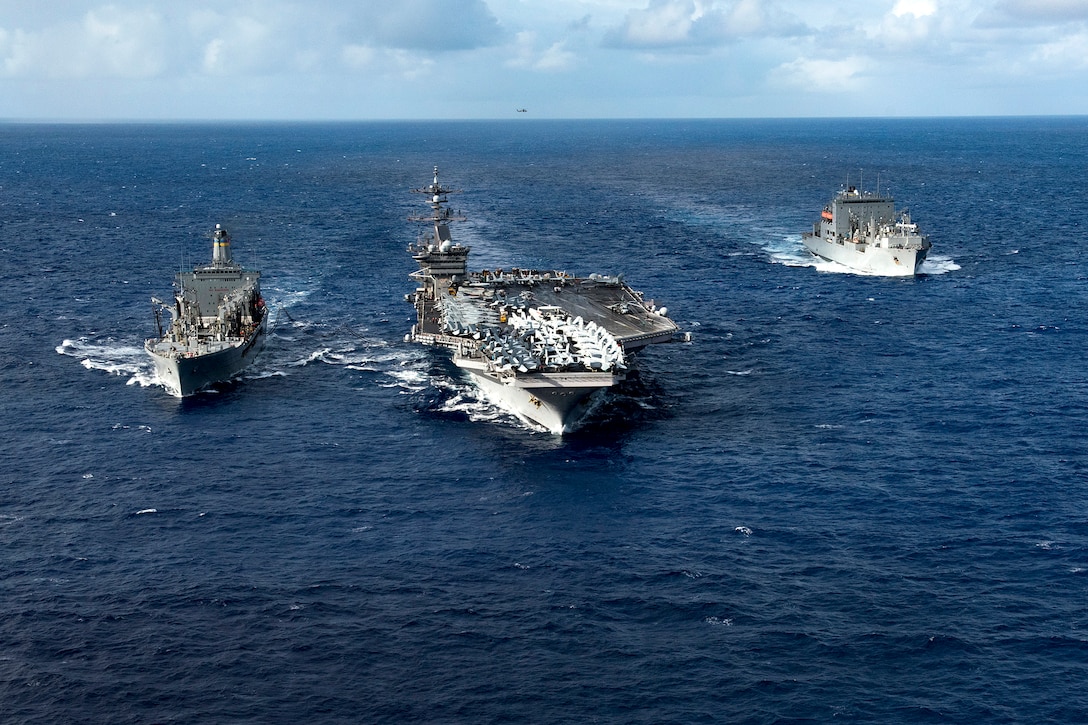 The aircraft carrier USS Carl Vinson participates in a dual replenishment-at-sea with the Military Sealift Command dry cargo and ammunition ship USNS Charles Drew, right, and the fleet replenishment oiler USNS Pecos in the Pacific Ocean, Feb. 3, 2017. The Carl Vinson Carrier Strike Group is on a regularly scheduled Western Pacific deploymentt. Navy photo by Petty Officer 3rd Class Matt Brown